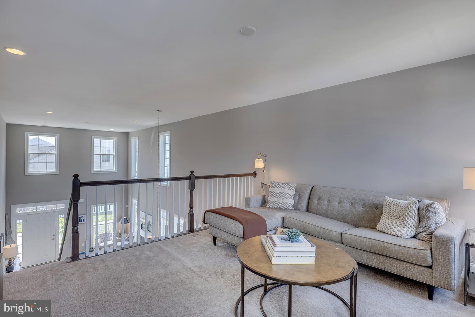 303 Brick Lane Milton, DE 19968 - Photo 26 of 71 a living room with furniture and a table