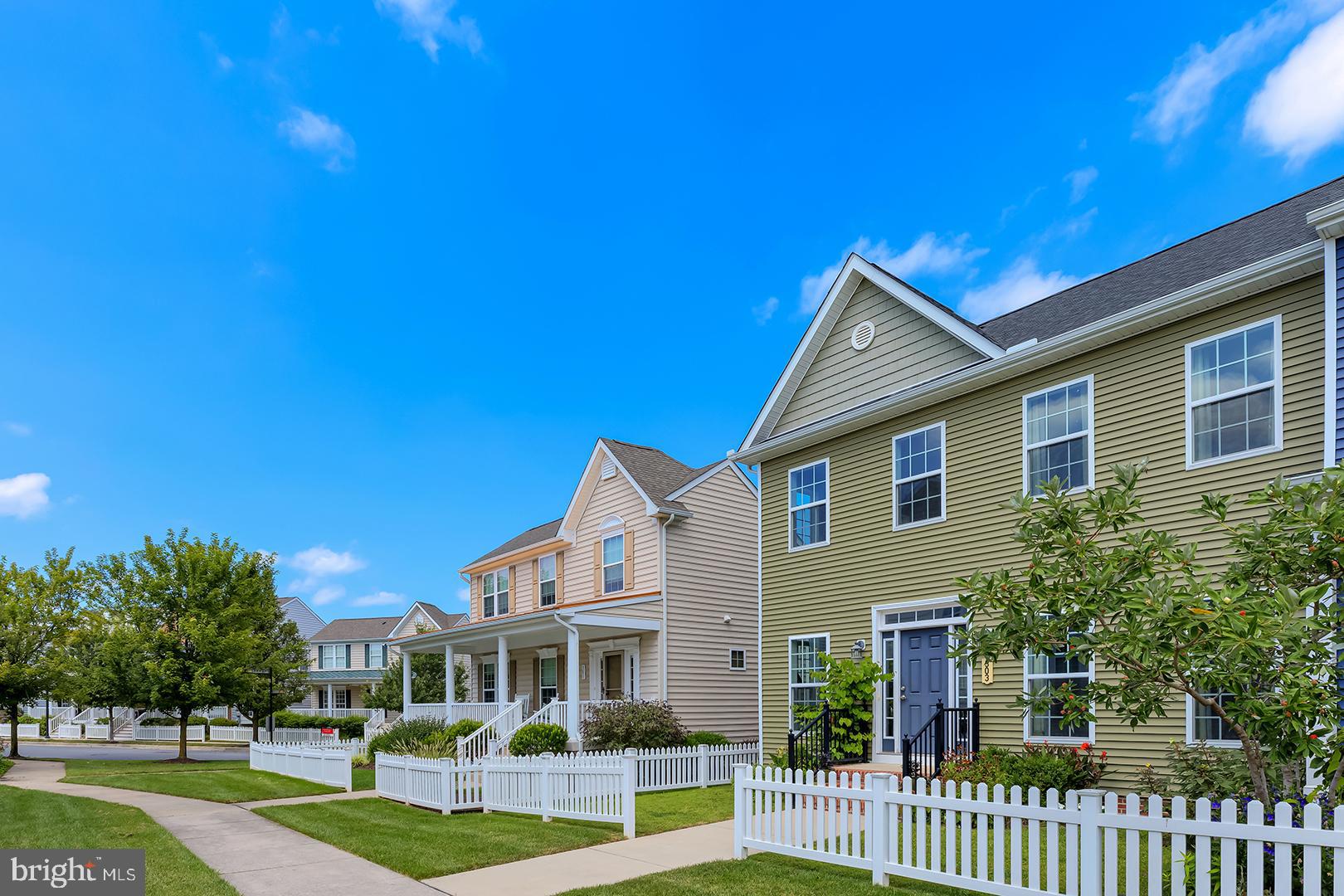 303 Brick Lane Milton, DE 19968 - Photo 3 of 71 a front view of a house with a yard