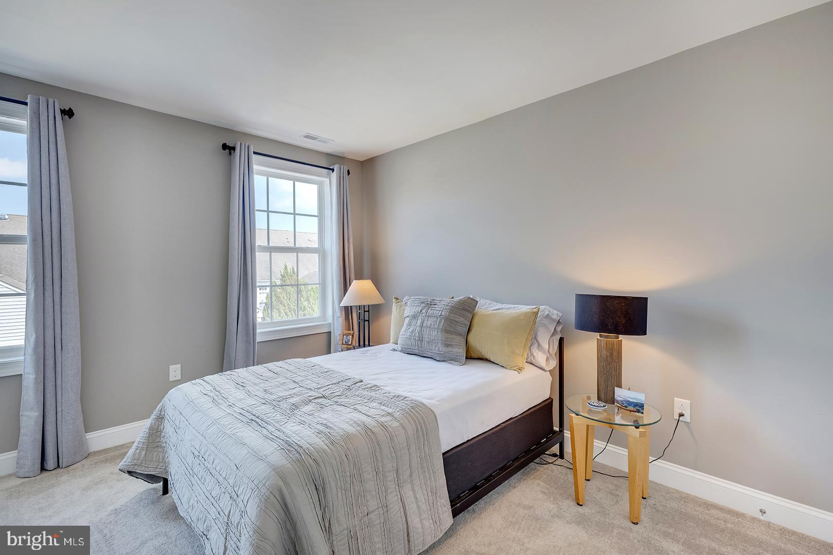 303 Brick Lane Milton, DE 19968 - Photo 34 of 71 a bedroom with a bed and window