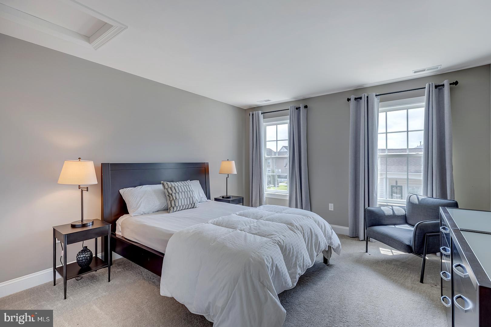 303 Brick Lane Milton, DE 19968 - Photo 40 of 71 a bedroom with a bed and a window