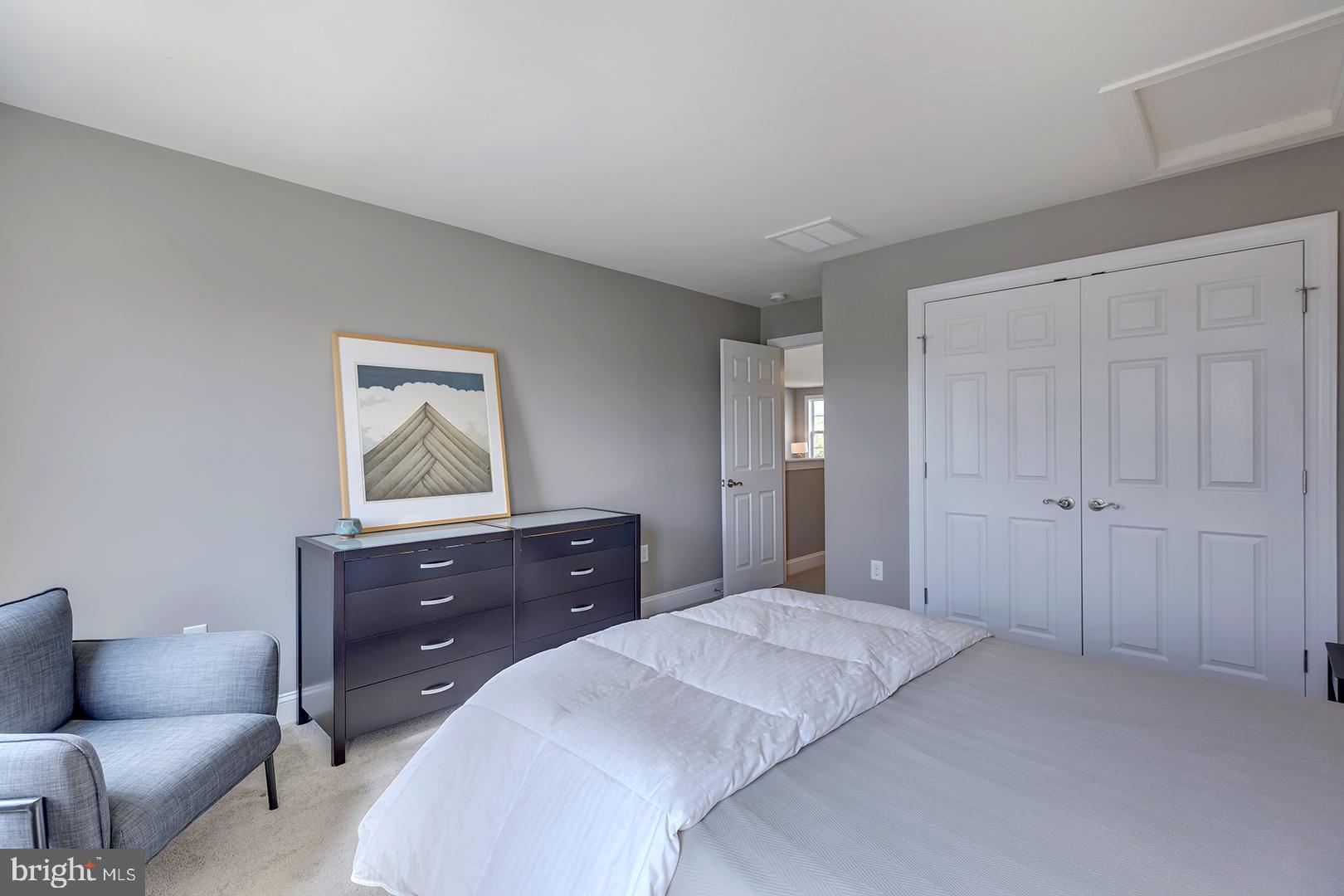 303 Brick Lane Milton, DE 19968 - Photo 42 of 71 a bedroom with a bed and a couch