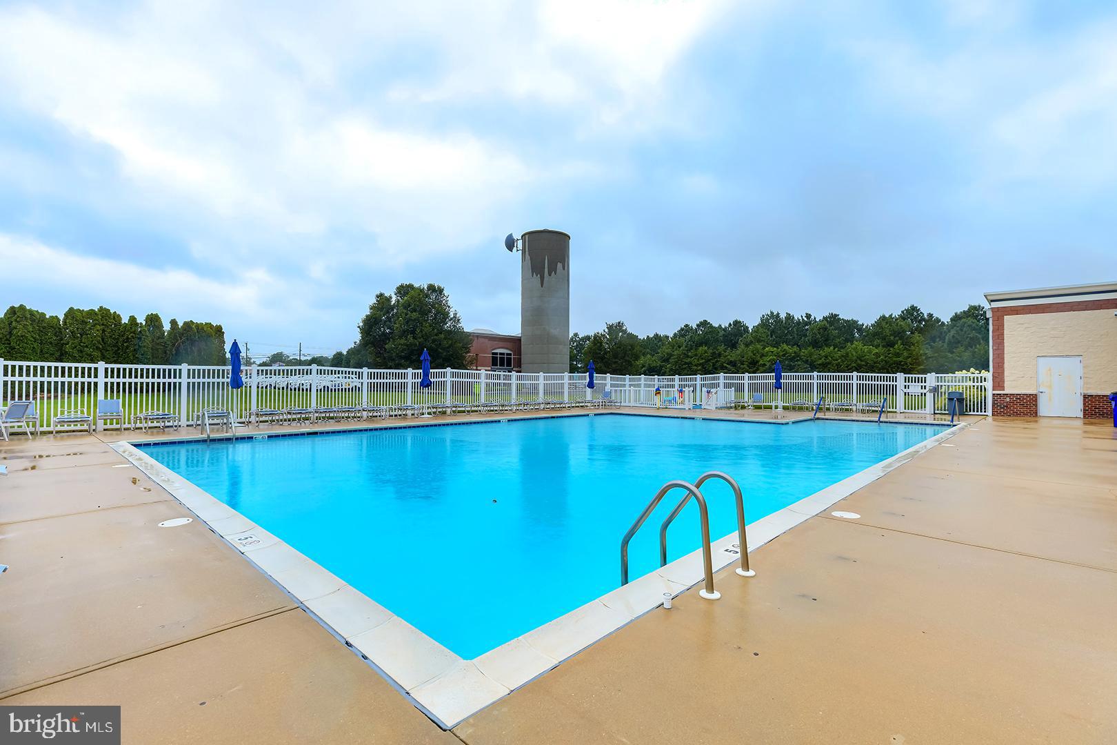 303 Brick Lane Milton, DE 19968 - Photo 55 of 71 a view of a swimming pool with a lake view