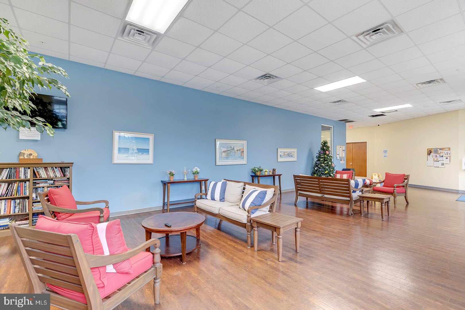 303 Brick Lane Milton, DE 19968 - Photo 60 of 71 a living room with furniture and a wooden floor