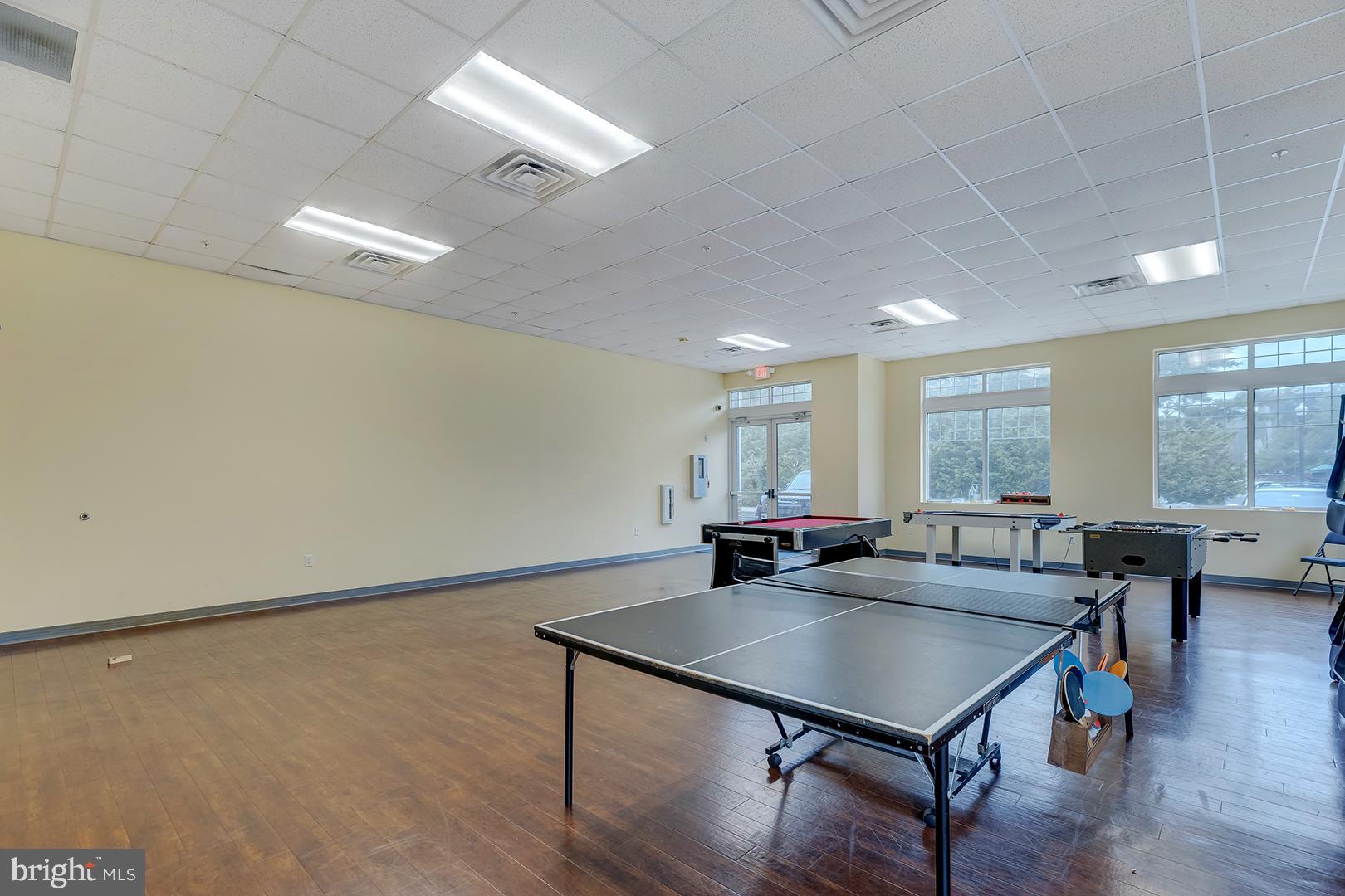 303 Brick Lane Milton, DE 19968 - Photo 62 of 71 a living room with stainless steel appliances furniture a rug and a large window