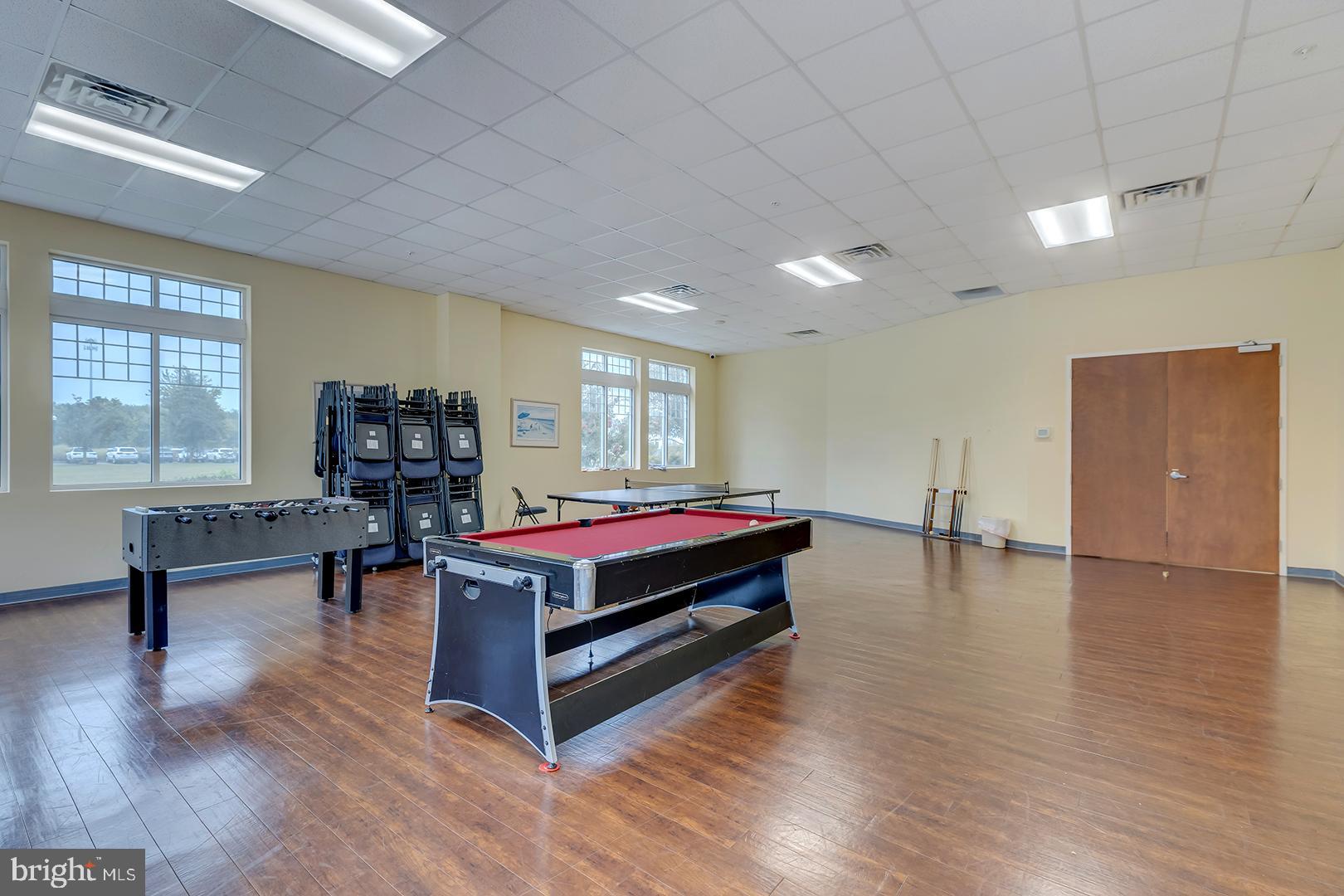 303 Brick Lane Milton, DE 19968 - Photo 63 of 71 a living room with furniture and wooden floor