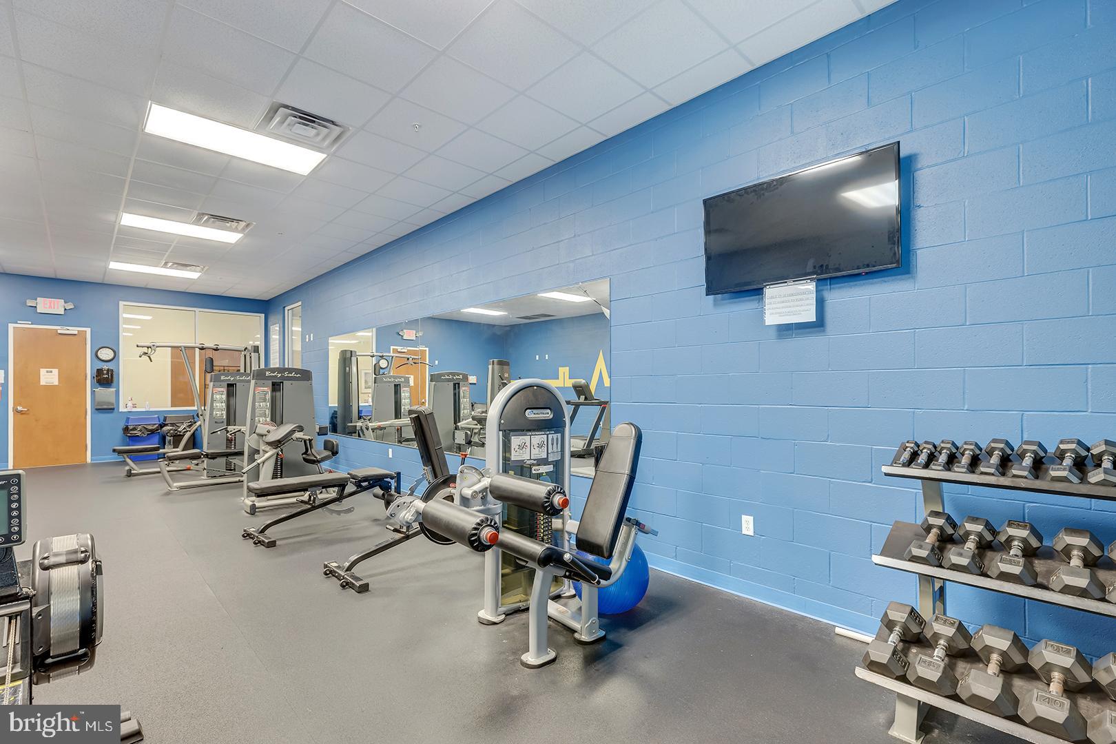 303 Brick Lane Milton, DE 19968 - Photo 68 of 71 a view of a livingroom with workspace and a couch