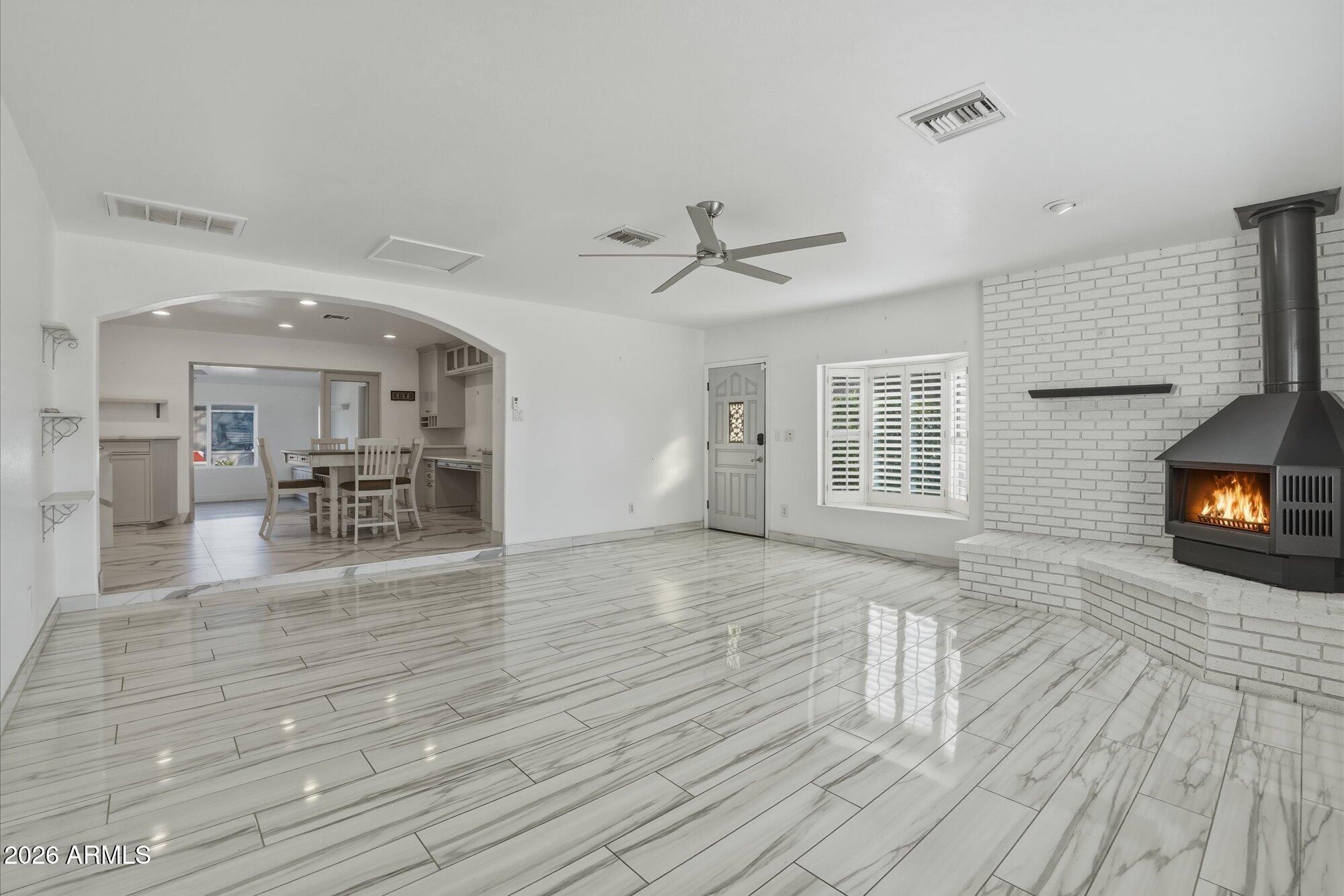 1532 West Loma Lane Phoenix, AZ 85021 - Photo 2 of 19 a living room with furniture and a fireplace
