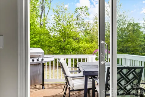 a view of backyard of house with seating space