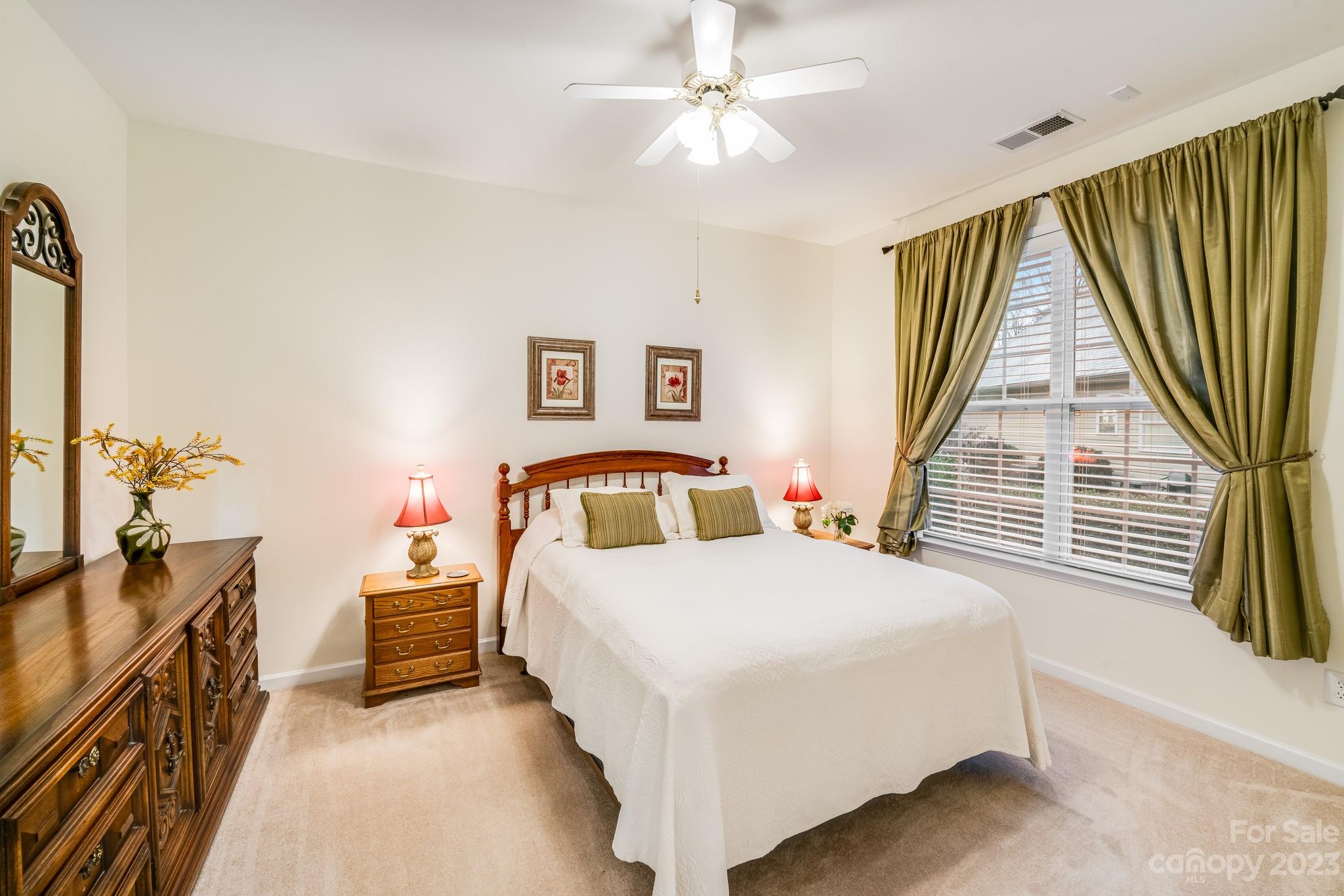 1037 Peridot Court Fort Mill, SC 29708 - Photo 20 of 33 a bedroom with a bed next to a large window with the outer view