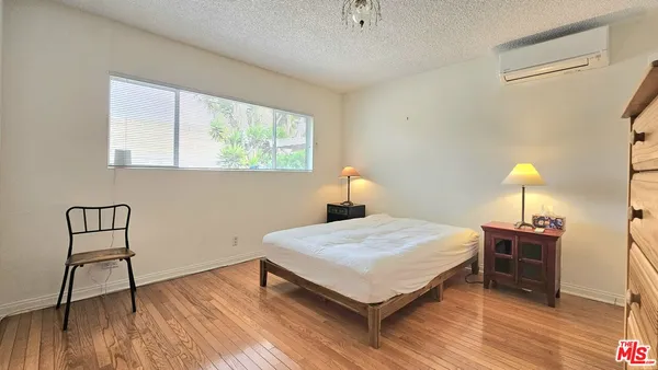 a spacious bathroom with a bathtub and a sink