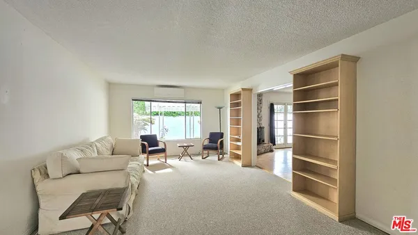 a kitchen with a stove sink and cabinets