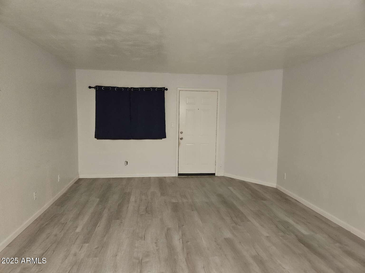 2220 West Dora Street, Unit 114 Mesa, AZ 85201 - Photo 17 of 17 a view of an empty room