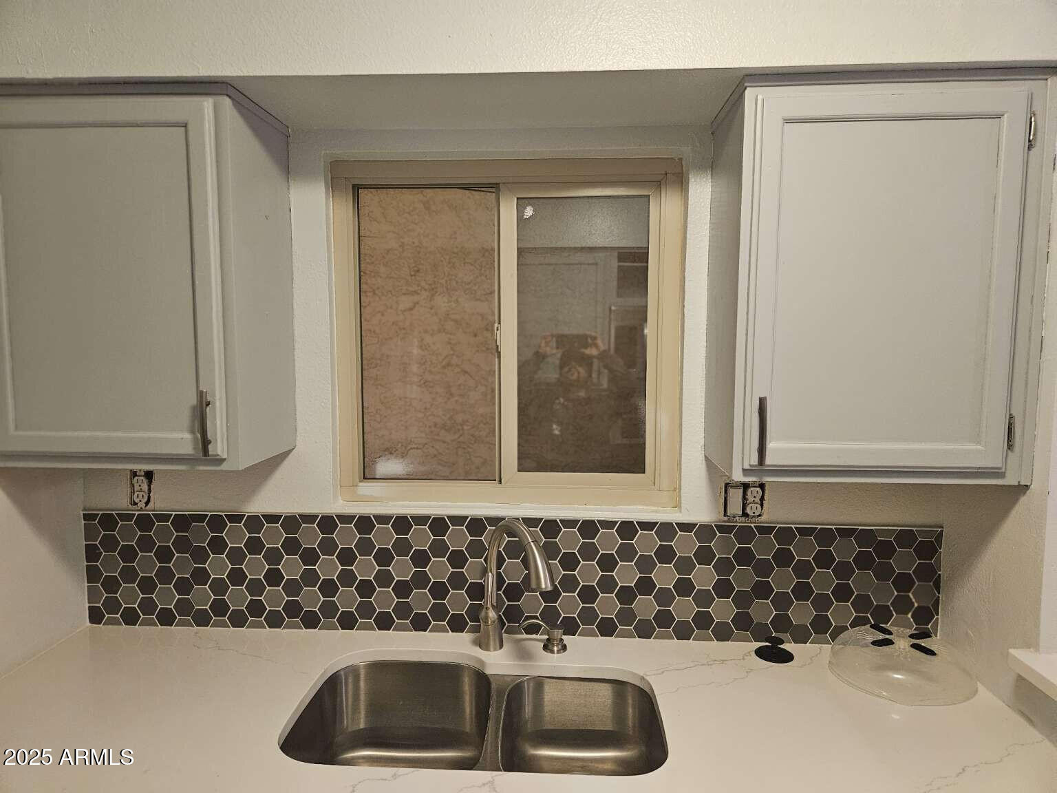 2220 West Dora Street, Unit 114 Mesa, AZ 85201 - Photo 2 of 17 a bathroom with a sink and a window