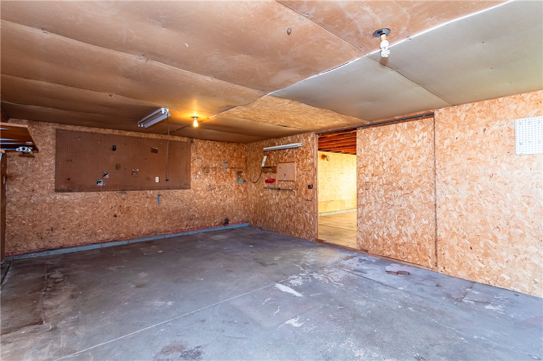 5760 Kitridge Road Dayton, OH 45424 - Photo 13 of 19 This functional garage offers ample space for vehicles and storage, with durable concrete flooring.