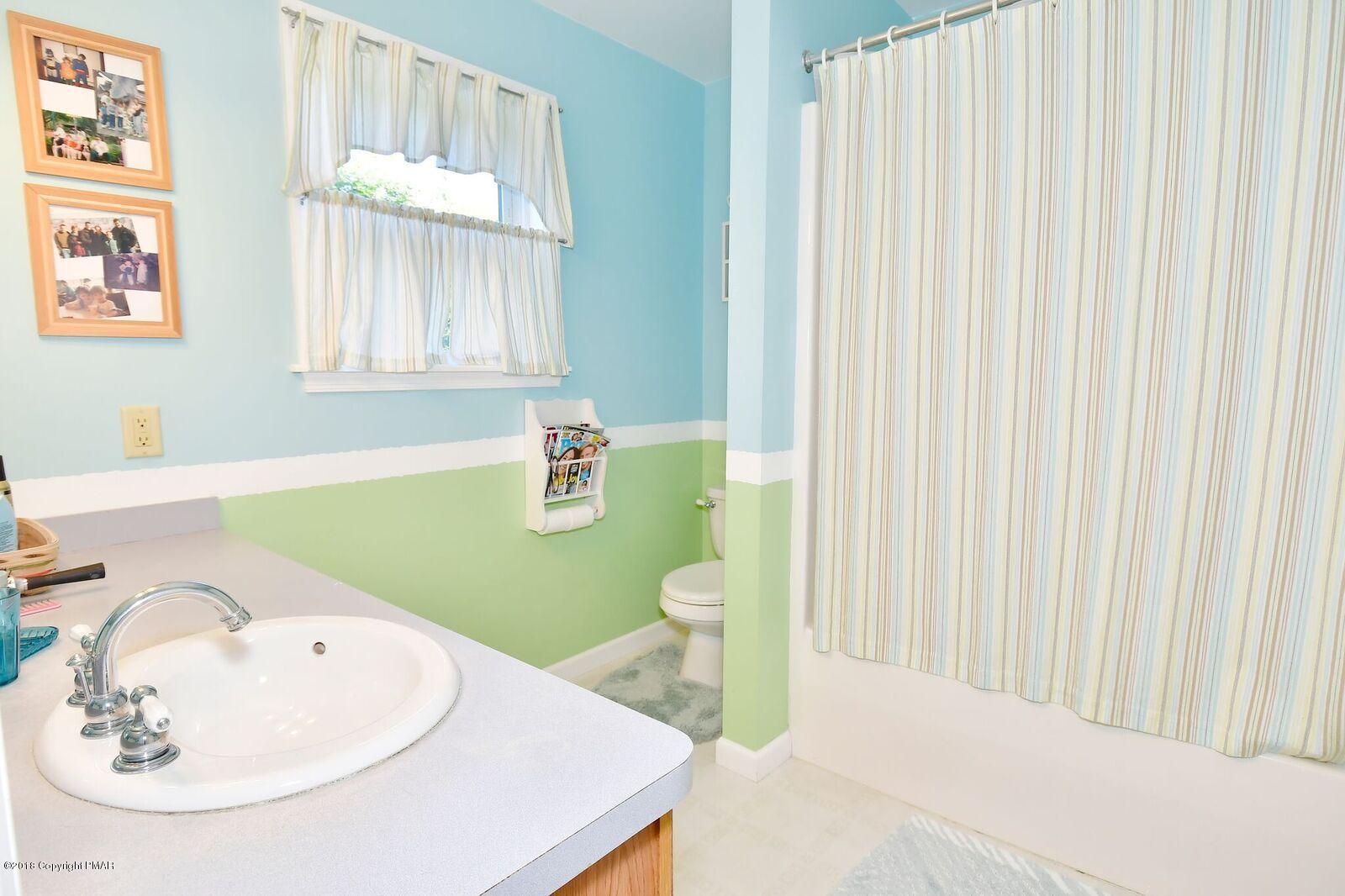 1185 Bangor Road Pen Argyl, PA 18072 - Photo 21 of 34 a bathroom with a sink and a mirror