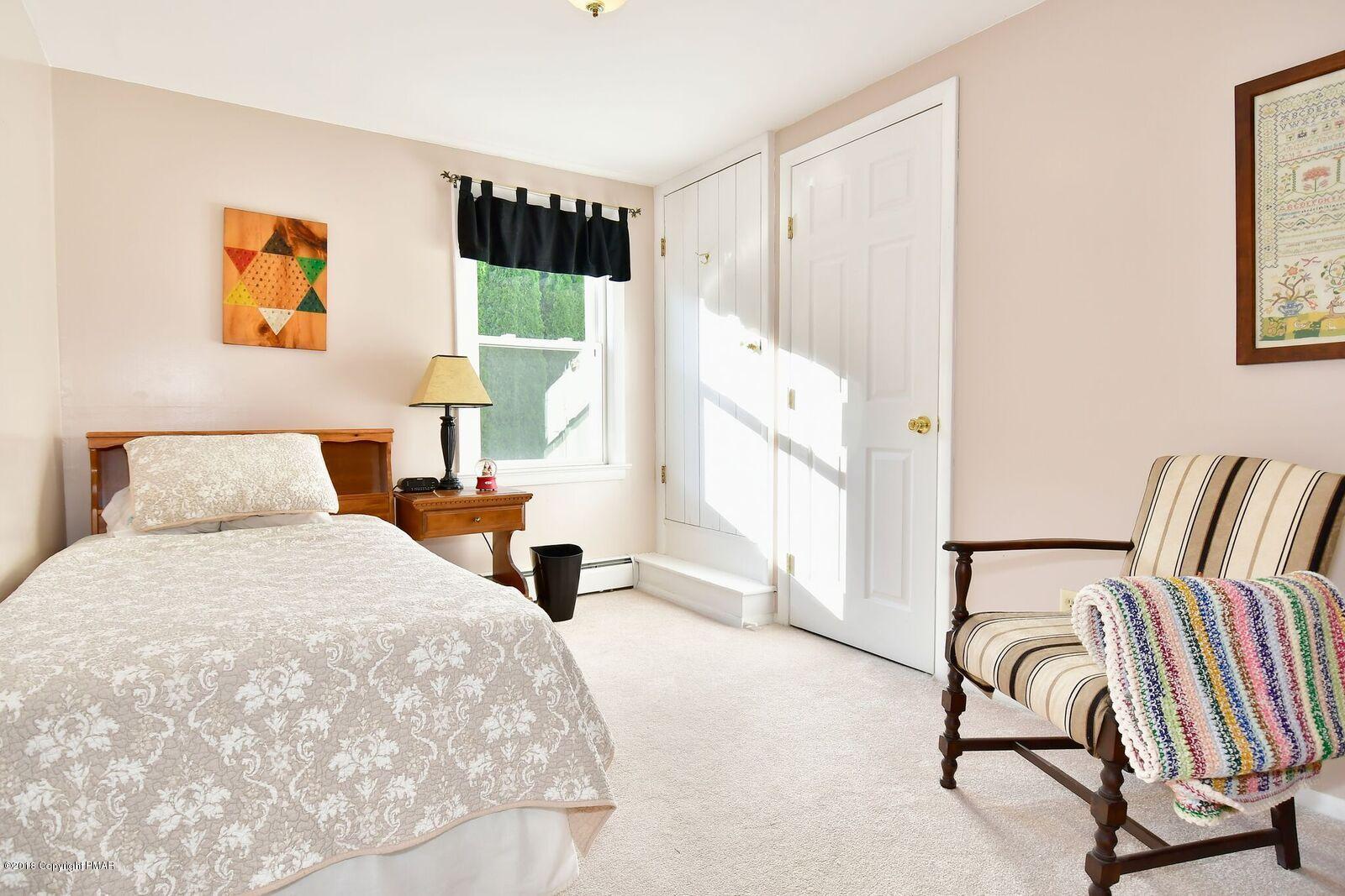 1185 Bangor Road Pen Argyl, PA 18072 - Photo 23 of 34 a bedroom with a bed and wooden floor