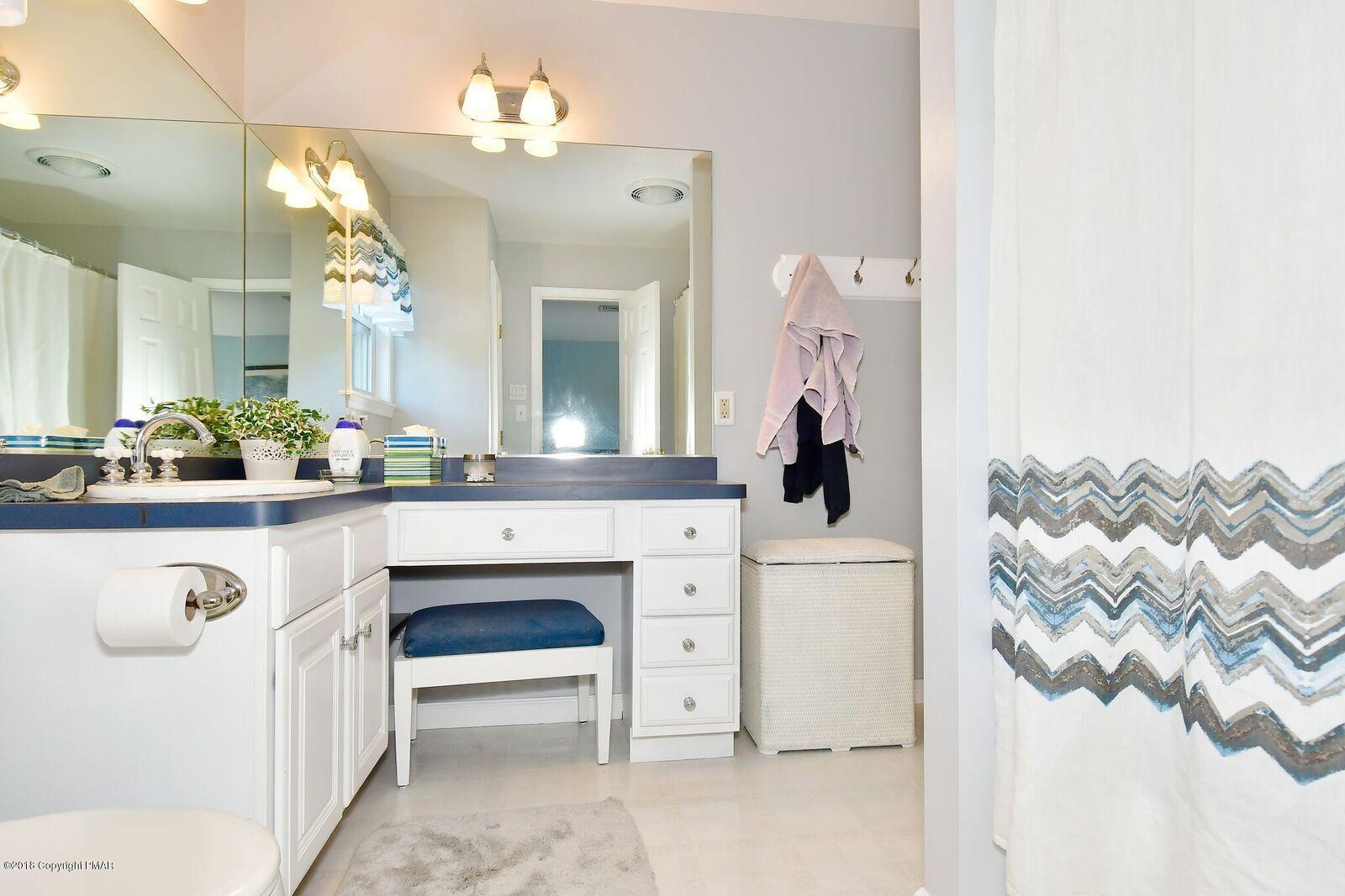 1185 Bangor Road Pen Argyl, PA 18072 - Photo 28 of 34 a bathroom with a sink vanity and a mirror
