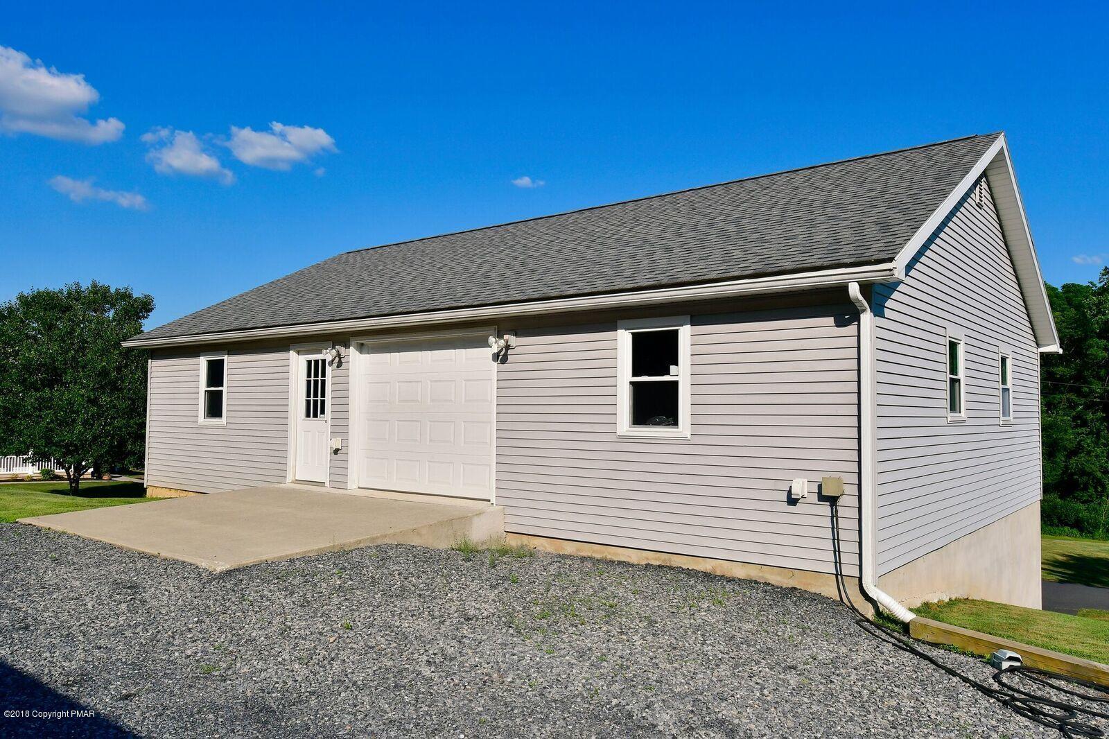 1185 Bangor Road Pen Argyl, PA 18072 - Photo 30 of 34 a view of a house with a backyard