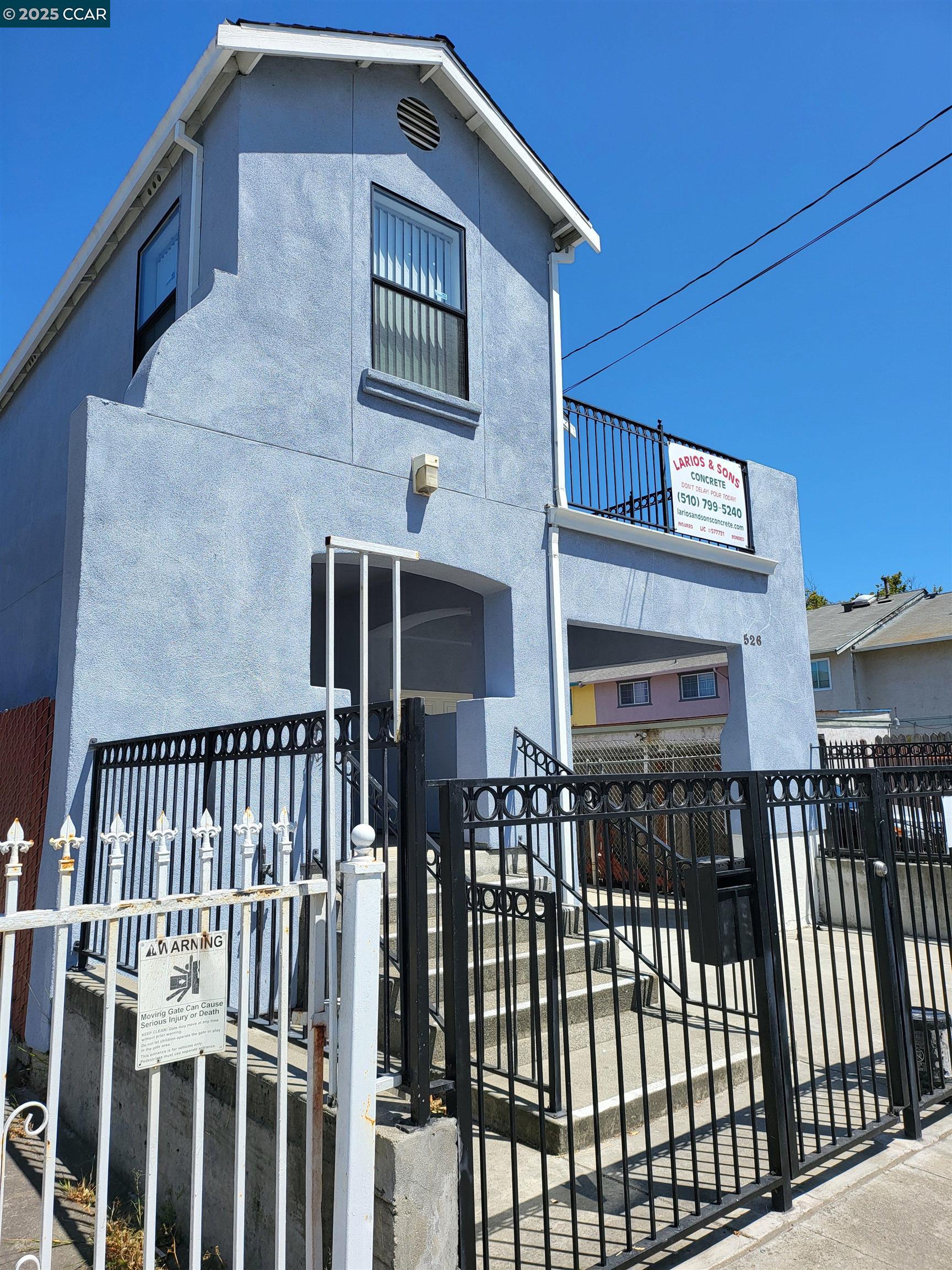 526 Harbour Way Richmond, CA 94801 - Photo 1 of 15 a view of a house with wooden fence and large windows