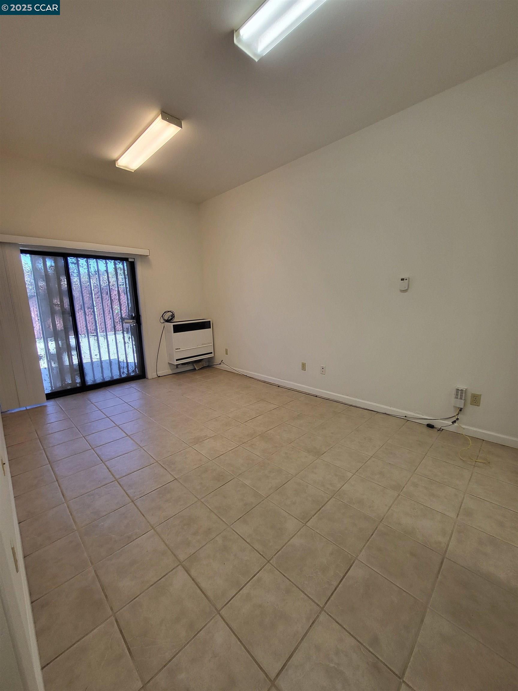 526 Harbour Way Richmond, CA 94801 - Photo 11 of 15 a view of an empty room and window