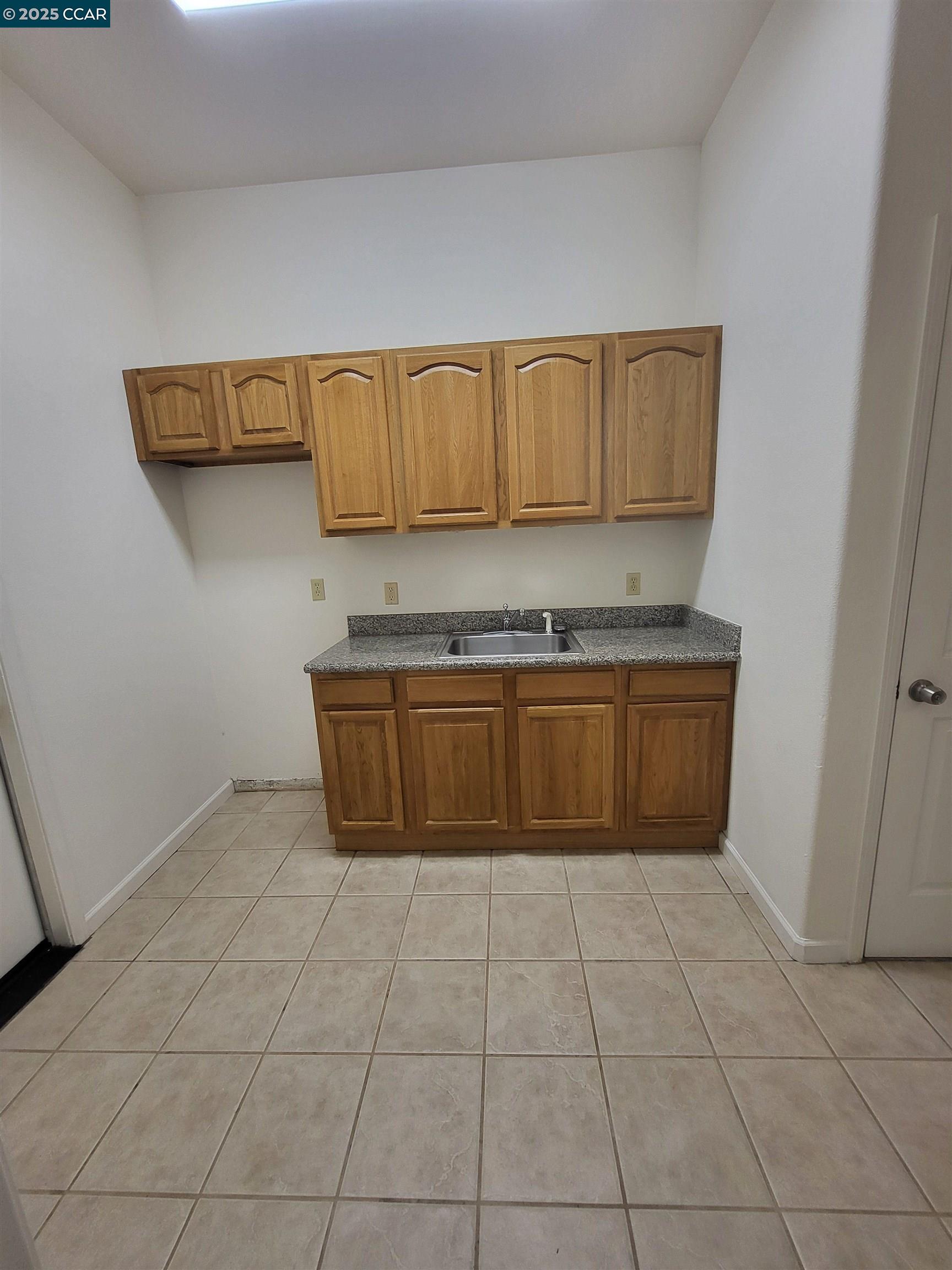 526 Harbour Way Richmond, CA 94801 - Photo 12 of 15 a kitchen with a stove top oven and cabinets