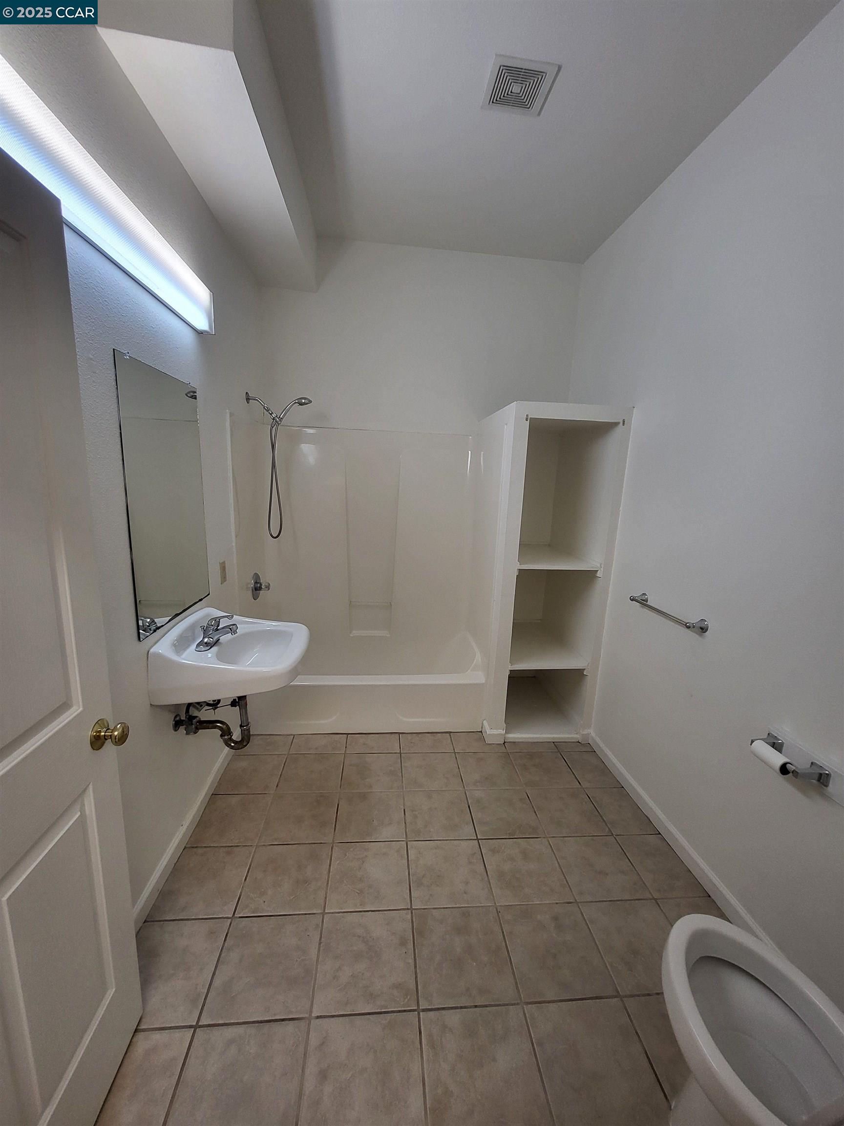 526 Harbour Way Richmond, CA 94801 - Photo 13 of 15 a bathroom with a sink a toilet and shower