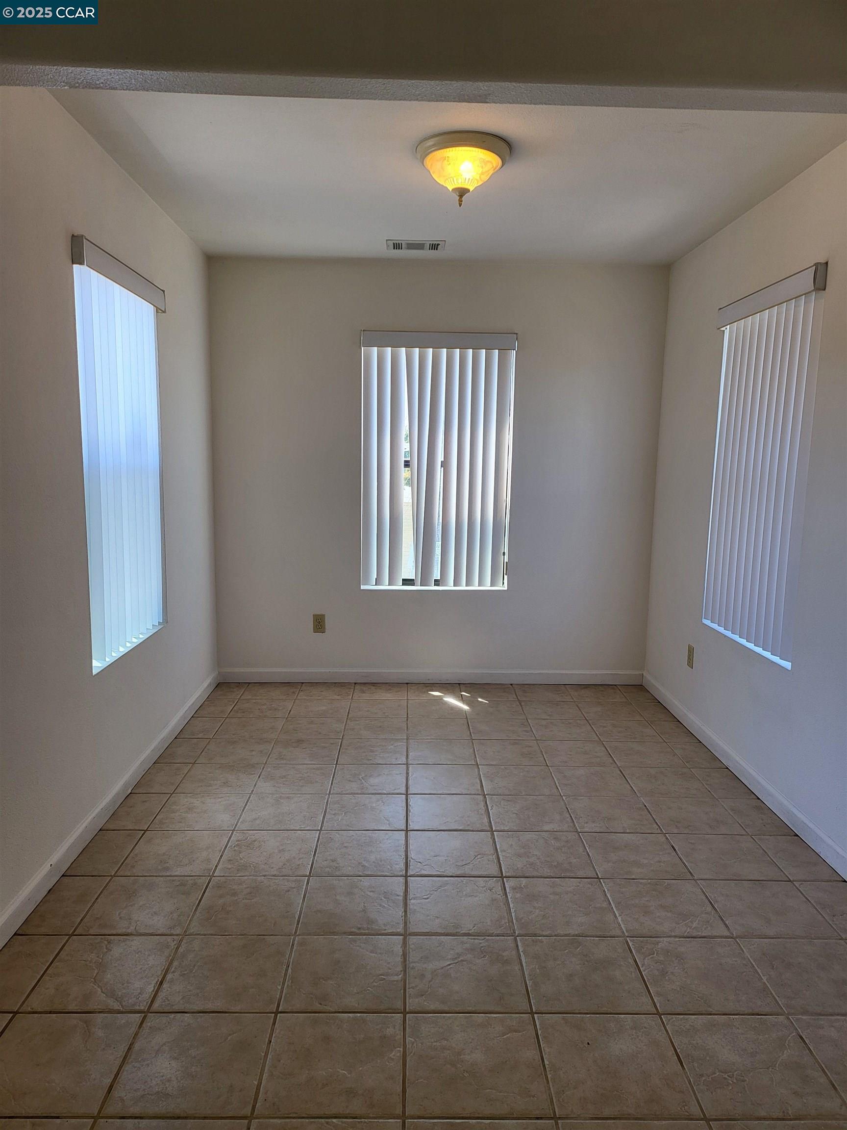 526 Harbour Way Richmond, CA 94801 - Photo 2 of 15 a view of an empty room with a window