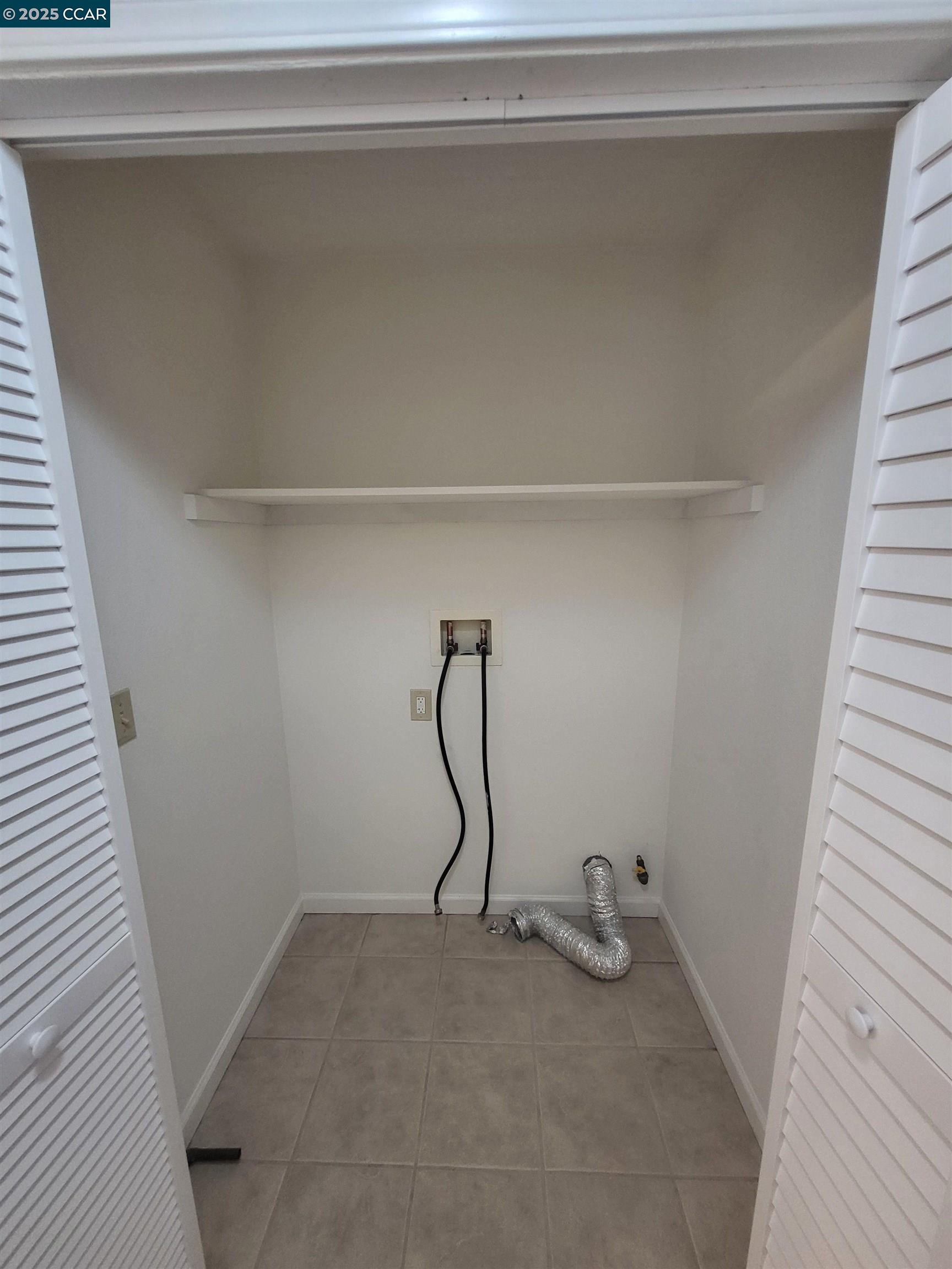 526 Harbour Way Richmond, CA 94801 - Photo 5 of 15 a view of small space with racks on the wall