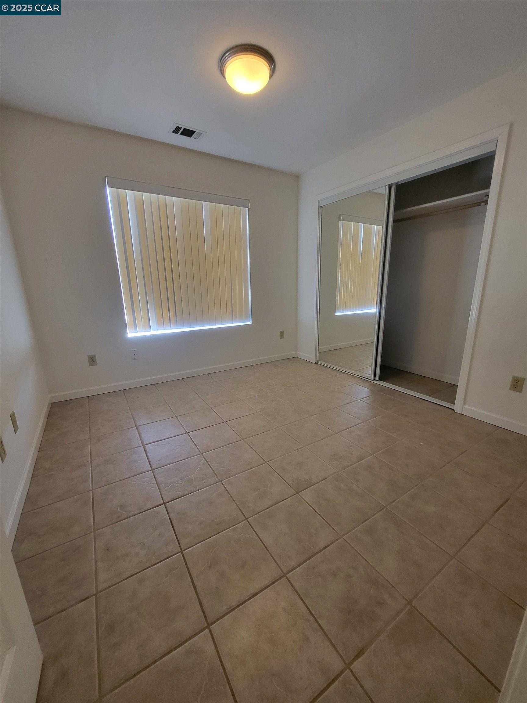 526 Harbour Way Richmond, CA 94801 - Photo 6 of 15 a view of an empty room with a window