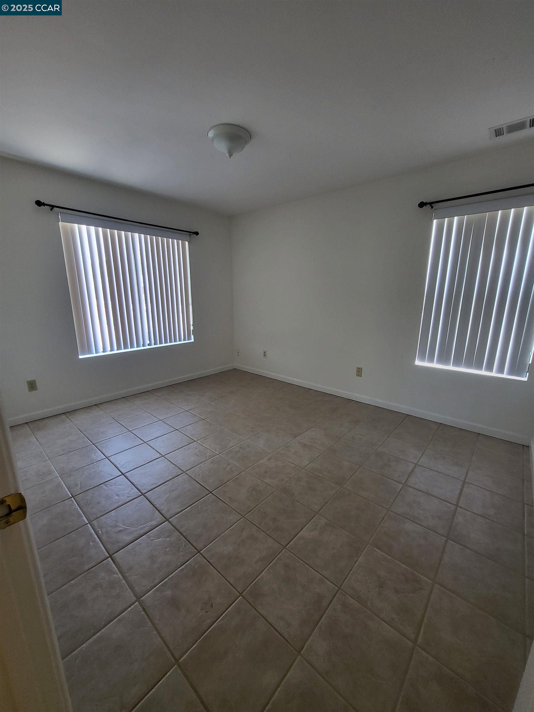 526 Harbour Way Richmond, CA 94801 - Photo 8 of 15 an empty room with windows