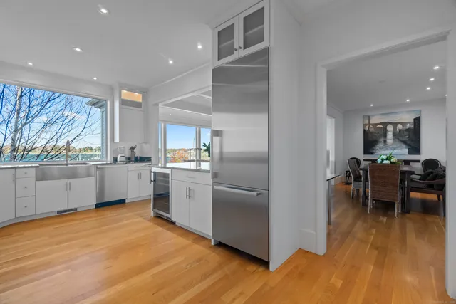 a kitchen with stainless steel appliances a refrigerator and a stove top oven
