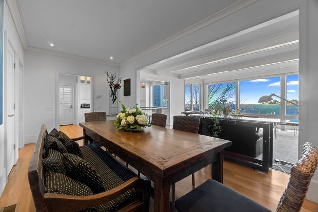 a kitchen with a table chairs and stove