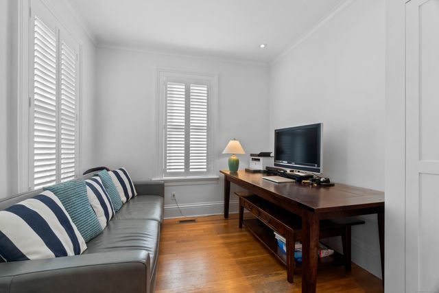 a view of a livingroom with furniture and stairs