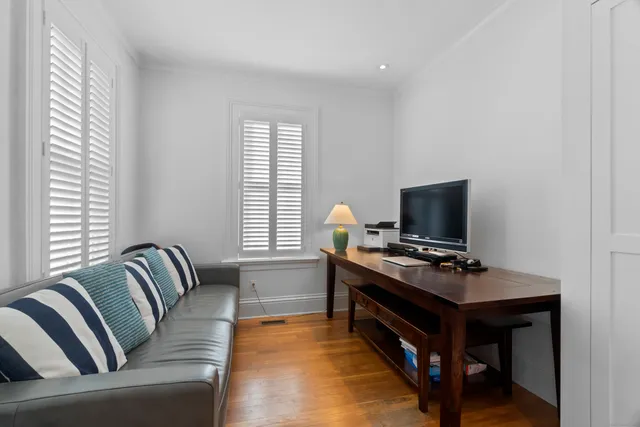 a view of a livingroom with furniture and stairs