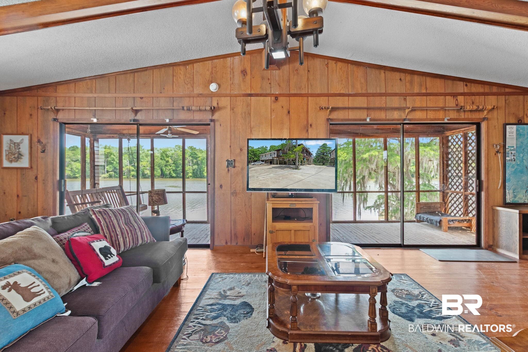 8153 Bryant's Lndg Road Stockton, AL 36579 - Photo 5 of 87 Vaulted ceilings with exposed wood beams, wood-paneled walls, and wood-finish flooring