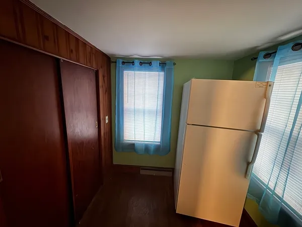 a bathroom with a shower curtain and sink