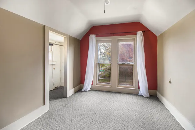 a view of a room with large windows