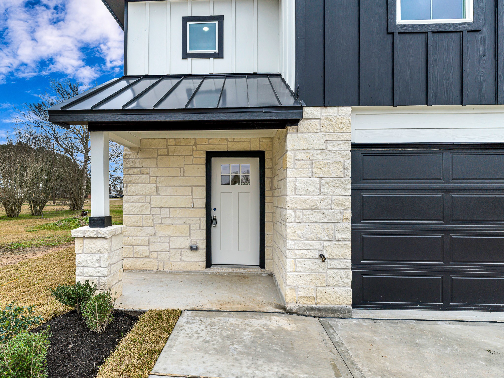 1006 4th Street Hempstead, TX 77445 - Photo 4 of 29 a front view of a house with a garage