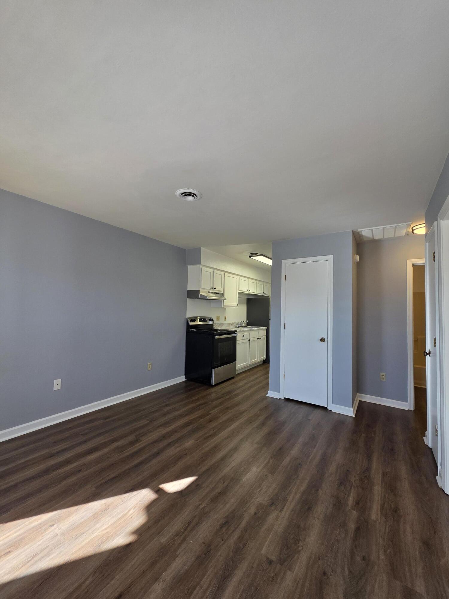 1105 Riverside Boulevard Southwest Roanoke, VA 24016 - Photo 5 of 11 a view of empty room with wooden floor