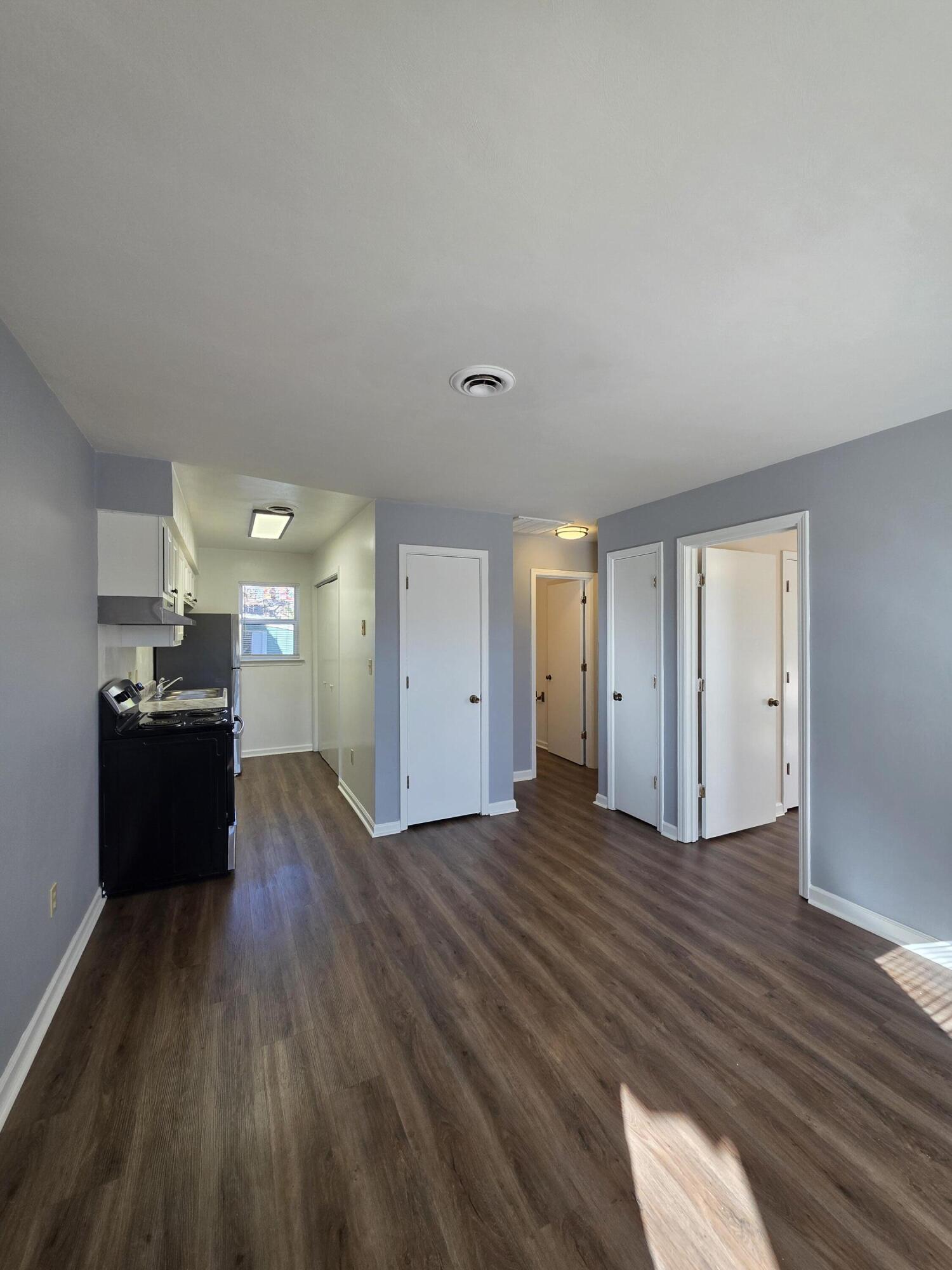 1105 Riverside Boulevard Southwest Roanoke, VA 24016 - Photo 6 of 11 a view of a big room with wooden floor and windows