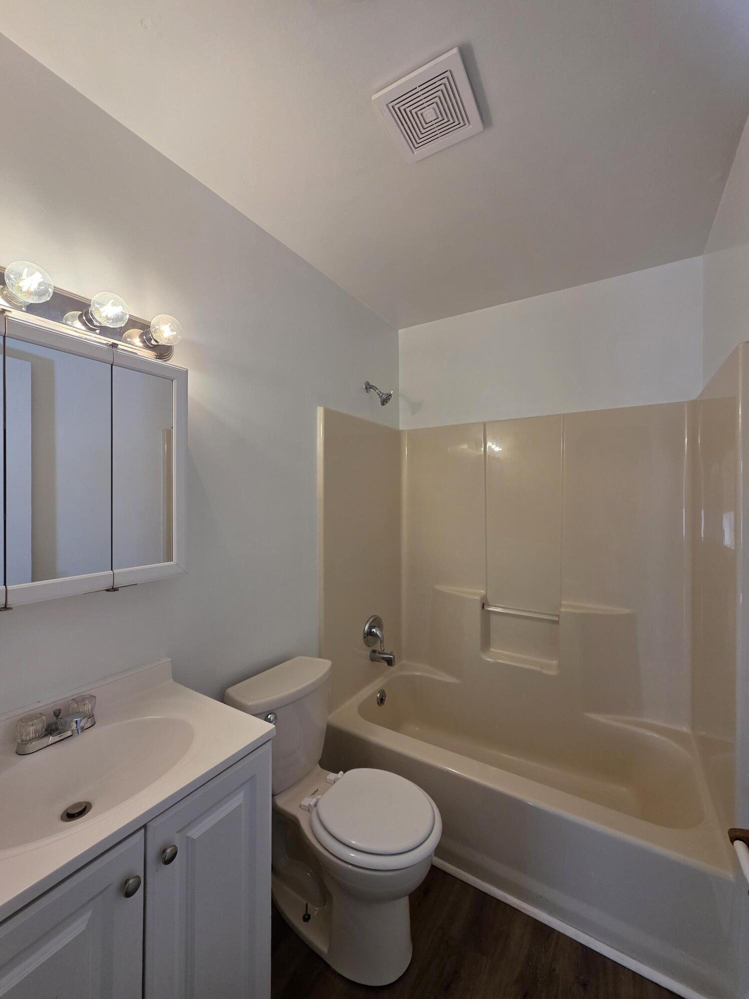1105 Riverside Boulevard Southwest Roanoke, VA 24016 - Photo 8 of 11 a bathroom with a sink a toilet and shower