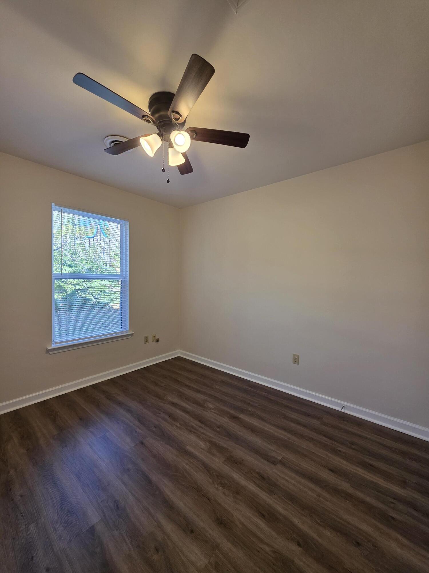1105 Riverside Boulevard Southwest Roanoke, VA 24016 - Photo 9 of 11 a view of an empty room with window and wooden floor