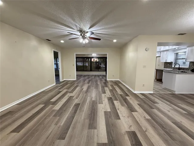 a view of a kitchen with a sink and a stove