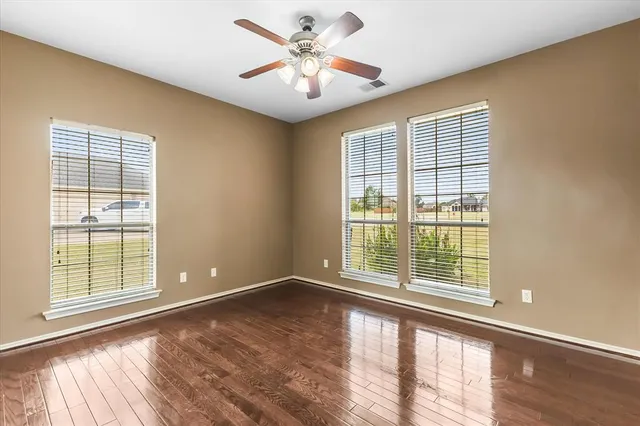 a view of an empty room with a window