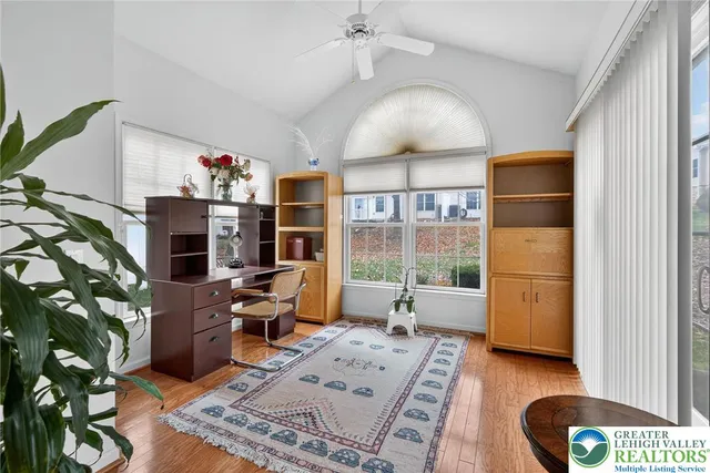 a living room with furniture and a window