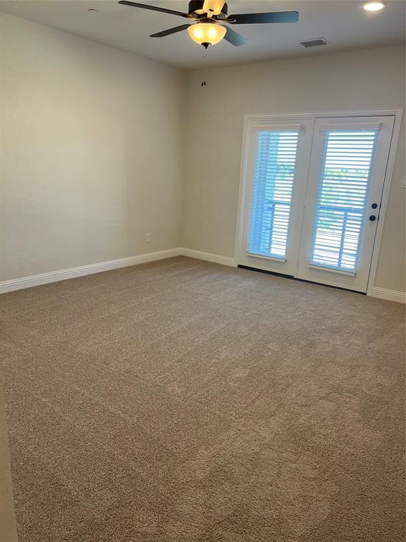 2522 Brunswick Way Allen, TX 75013 - Photo 13 of 19 an empty room with windows and fan