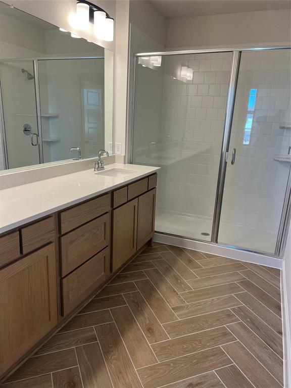 2522 Brunswick Way Allen, TX 75013 - Photo 14 of 19 a bathroom with a mirror and a shower