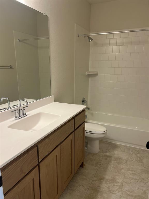 2522 Brunswick Way Allen, TX 75013 - Photo 17 of 19 a bathroom with a sink a toilet and shower