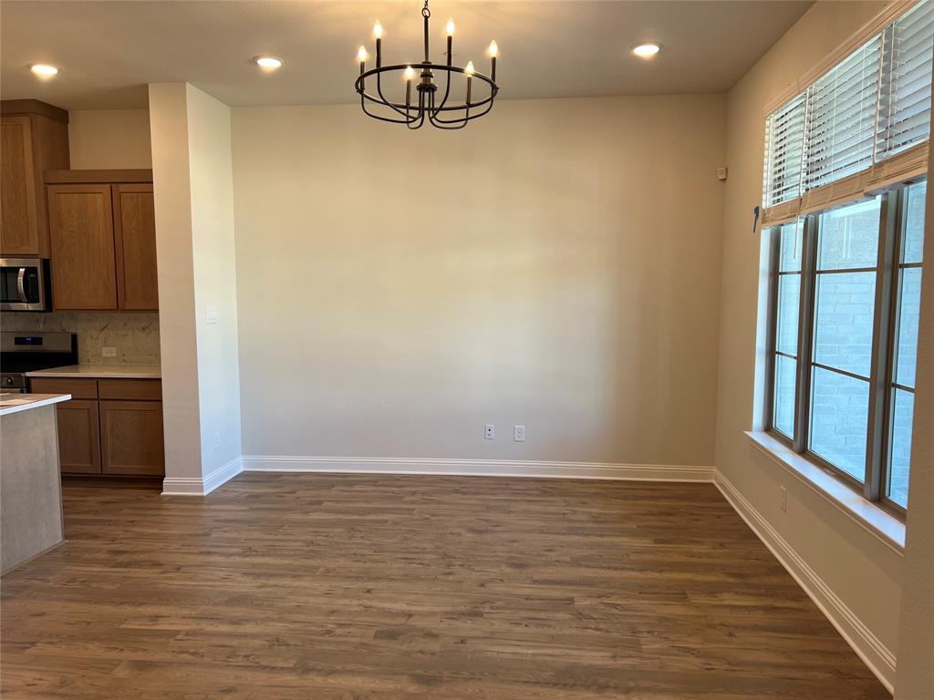 2522 Brunswick Way Allen, TX 75013 - Photo 5 of 19 a view of kitchen with stainless steel appliances wooden floor and a large window