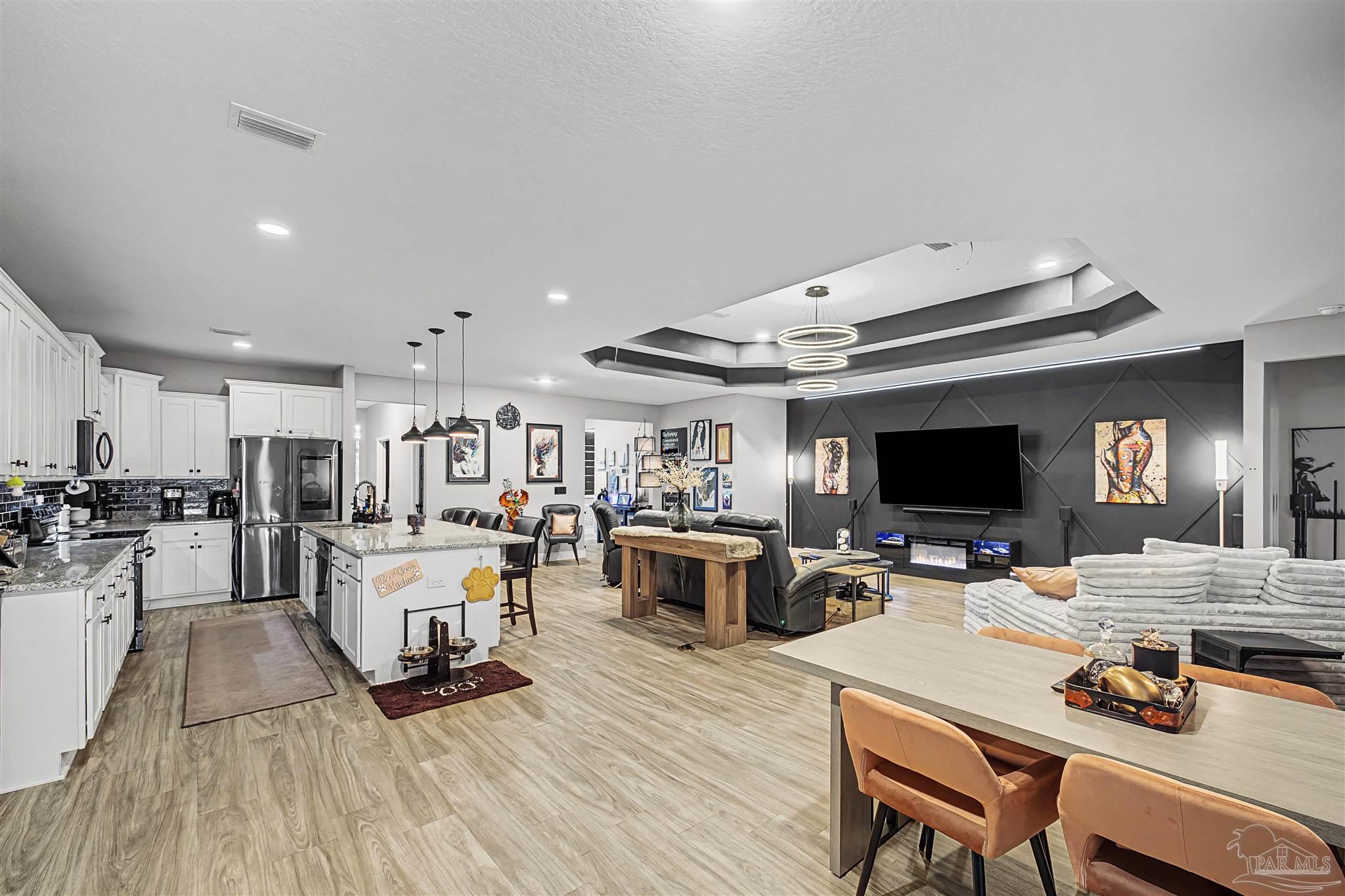 327 Cayden Way Cantonment, FL 32533 - Photo 12 of 64 a living room with furniture and a flat screen tv